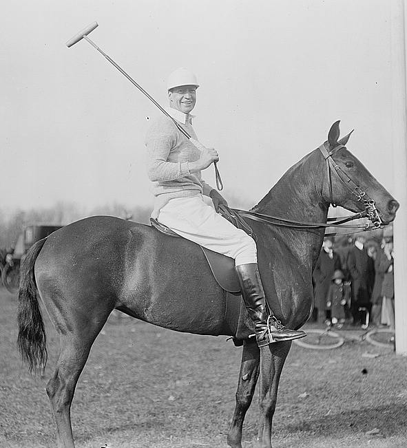 RL Agazzi on horseback playing polo